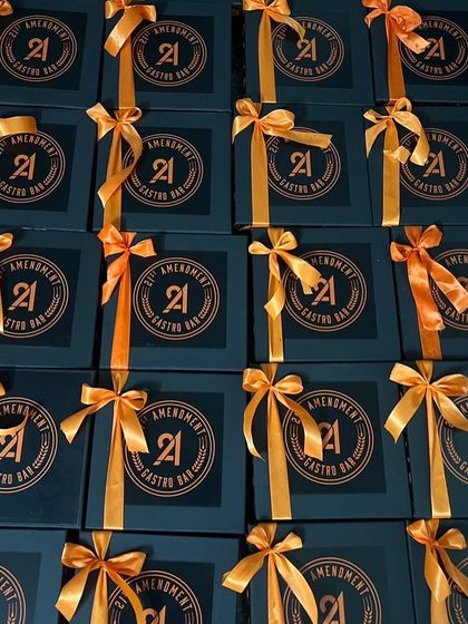 An army of Halloween gift boxes, all tied up and ready to go. We delivered these on a tight 48-hour timeline without compromising on the details.