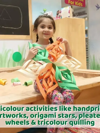 Another look at our Independence Day crafts. This little girl is proudly holding up her creation, a beautiful paper flower in the colors of the flag.