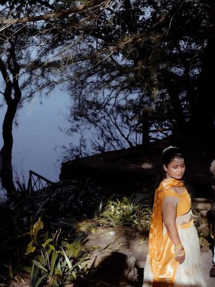 Another perspective of the lakeside Haldi shoot, capturing the serene and picturesque setting of their celebration.