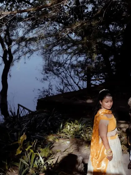 Another perspective of the lakeside Haldi shoot, capturing the serene and picturesque setting of their celebration.