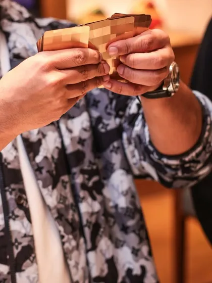 A close-up shot of my hands during a performance at a Louis Vuitton event. The details matter, both in high fashion and in high-end magic.