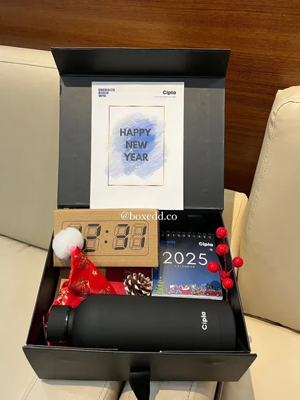 I help companies celebrate their teams in style. This sleek, custom-branded New Year hamper for Cipla included a personalized bottle, a desk calendar, and an LED clock to kick off the year with appreciation.