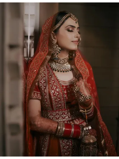 A serene portrait of Vaishali, her eyes closed, capturing a moment of peace and happiness on her wedding day.