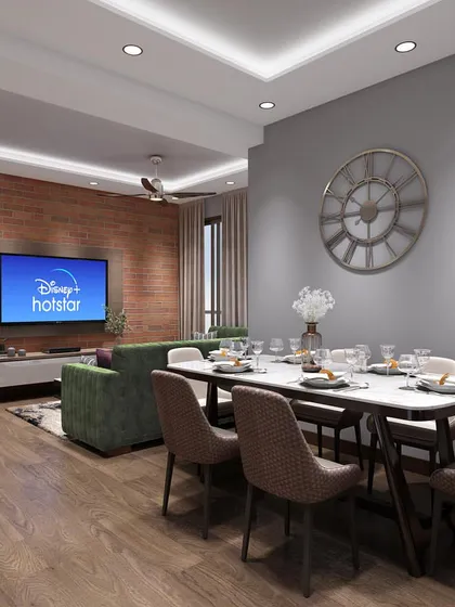 This wide shot shows how the living and dining areas flow together in an open-plan layout. We maintained a consistent design language with wooden flooring and neutral walls, while defining the two zones with distinct furniture and lighting.