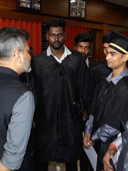 Speaking with a group of male graduates after the ceremony. I always make time to offer personal advice and listen to the aspirations of our youth.