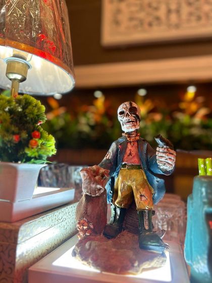 A close-up of a skeleton pirate figurine, one of the many detailed props we use to bring our themes to life.