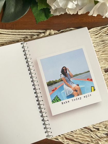 Another page from the planner booklet, featuring a travel photo with the caption 'Make today epic'. It's all about personalizing your daily motivation.