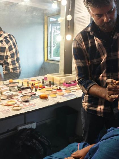 Another angle of the makeup session, showing the transformation that helps an actor get into character.