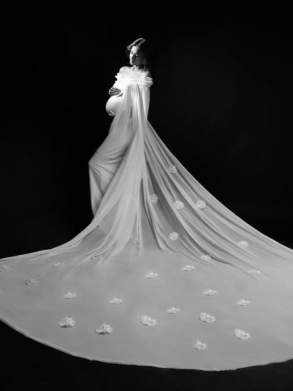 Inspired by the Met Gala, I created this mind-blowing look with a custom long trail, lace, and flowers. It’s all about capturing high-fashion elegance.