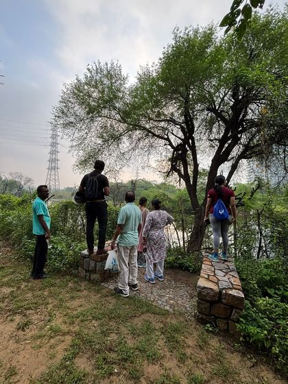 A group of citizens on a nature walk pauses to admire the view at Ghata Bundh, a restored site that will soon be open to the public.