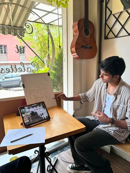 Here I am demonstrating a sketching technique on a whiteboard for the class to follow along.