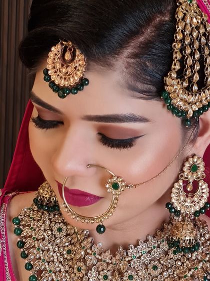 A close-up of my beautiful Muslim bride. The green meenakari work, the jhoomar, and the large nath are key elements of her traditional look.