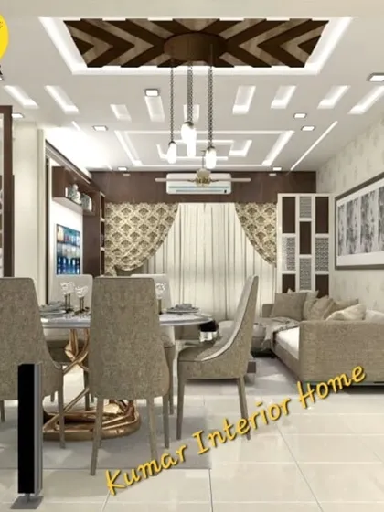 An integrated living and dining space with intricate false ceiling work. The design includes a CNC jali partition and a mix of neutral tones for a sophisticated look.