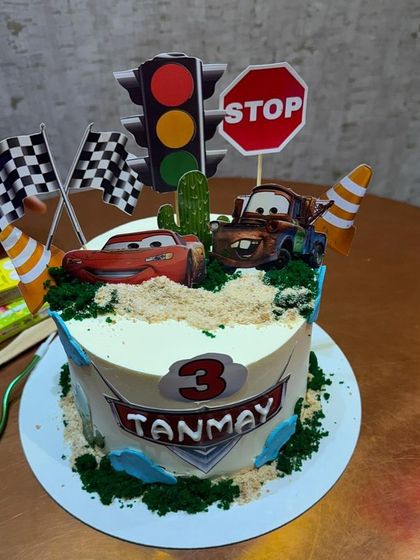 A fun Cars-themed cake, perfect for a child's birthday party.