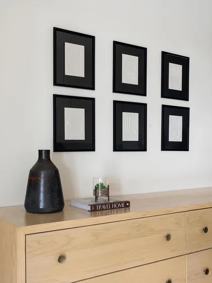 A beautiful light oak dresser with minimalist knob handles, custom-made for the Weespaces neutral chic home.