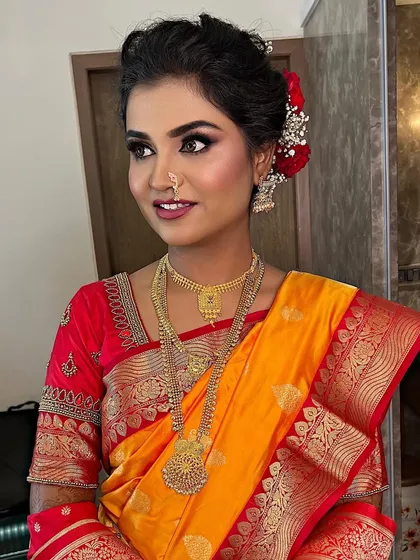 A beautiful portrait of a classic Maharashtrian bride. Her makeup is timeless, with defined eyes and a smile that lights up the room.
