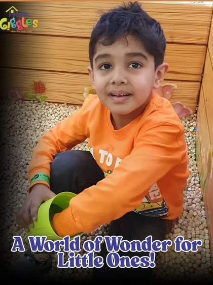 A world of wonder for little ones! This young explorer is enjoying our sensory pit, a perfect spot for tactile play that is both fun and developmental.