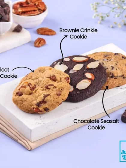 A selection of our gourmet eggless cookies. This image shows our chewy Apricot Pecan Cookie, the rich Brownie Crinkle Cookie, and our sophisticated Chocolate Seasalt Cookie.