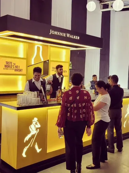 A branded Johnnie Walker bar setup for the Abraham & Thakore store launch. We collaborated with the beverage sponsor to create a pop-up bar that was seamlessly integrated into the event's monochrome theme.