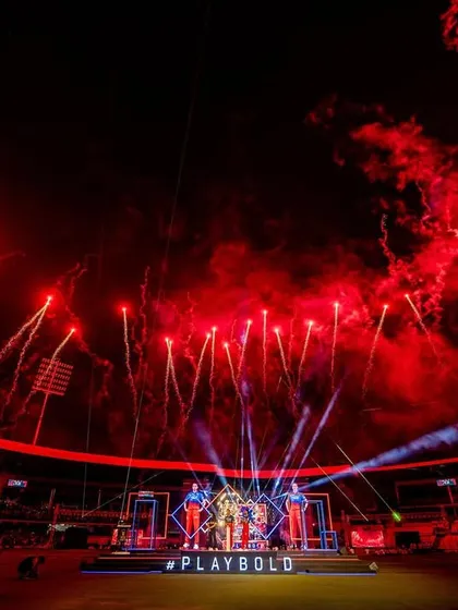 For RCB Unbox, we filled the stadium with the team's fiery spirit. This shot captures the peak of the event, with a custom stage design and a massive red firework display that created an electrifying atmosphere for tens of thousands of fans.