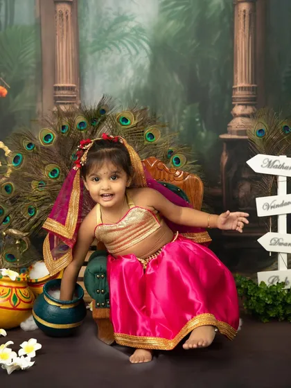 A beautiful little Radha with a happy, playful expression. The Janmashtami set is perfect for capturing the divine charm of both boys and girls.
