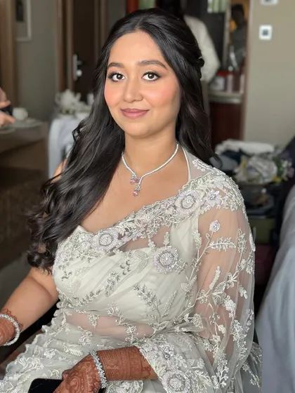 A beautiful portrait of the bride-to-be. Her makeup is timeless and elegant, making her look and feel her best for her Roka.