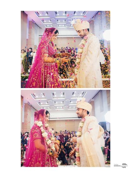 A two-part story of the Varmala ceremony. I capture both the playful attempt to put on the garland and the happy moment of success, telling a mini-story within one frame.