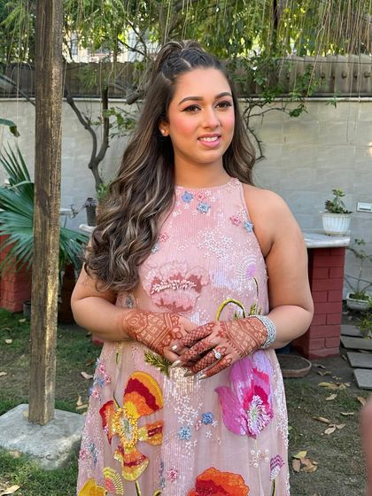 The full look, showing the modern pink dress and the fresh, glowing makeup that complements it perfectly.