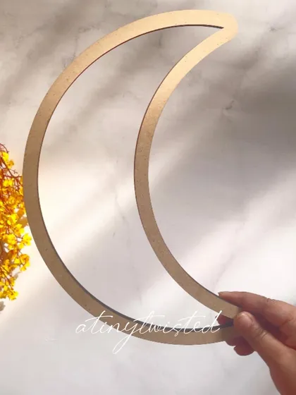 This crescent moon MDF frame is perfect for creating celestial-themed wall hangings or dreamcatchers. It provides a sturdy and beautifully shaped base for your macramé work.