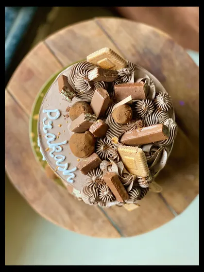 A top-down view of the Chocolate Overload cake, showing the variety of toppings.