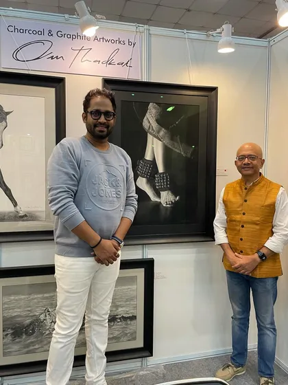 Posing with a guest in front of my Indian classical dance artwork 'Taal'.