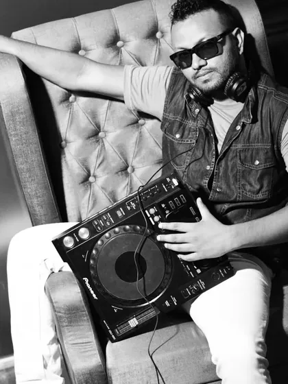 A professional black and white portrait of me with my gear. This represents my identity as a self-made artist dedicated to my music.