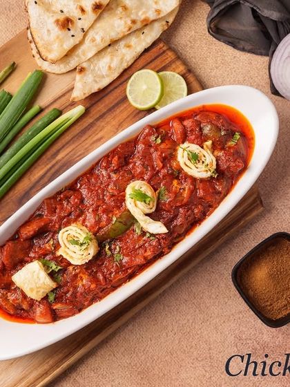 Our Chicken Lapeta features a thick, spicy gravy that clings to the tender chicken pieces. It's a robust and flavourful dish, garnished with egg swirls.