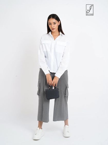 A standard e-commerce pose, showing the full outfit from the front with a small handbag as an accessory.