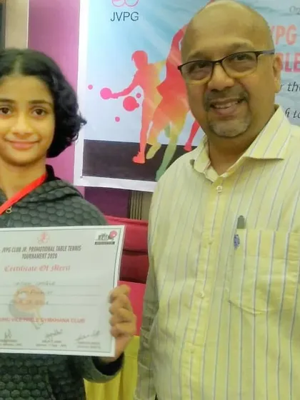 Vaidehi Chogle receiving her certificate of merit at the JVPG Club Jr. Promotional Tournament.