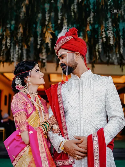 A look of love. This candid shot captures the couple gazing at each other, a simple moment that speaks volumes about their connection.