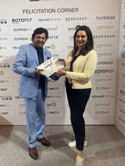 Receiving a felicitation at a dermatology event. I am grateful for the recognition from my peers and the opportunity to contribute to our professional community.