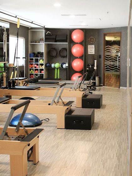 A peek into our studio, where reformers and stability balls are neatly arranged. We believe an organized space leads to an organized mind and body.