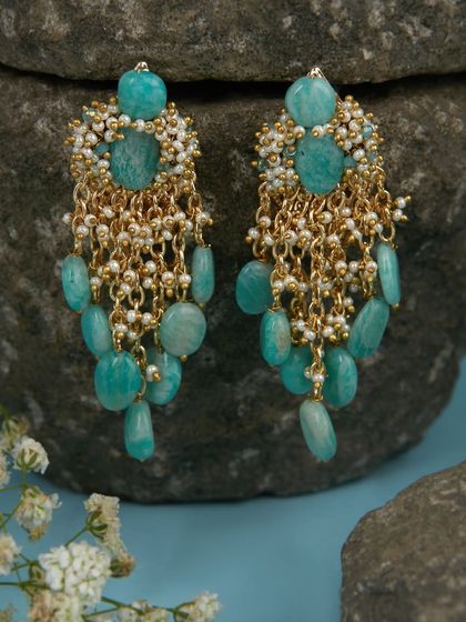 Our turquoise-toned stone danglers are still a favorite for adding a pop of colour to festive outfits.