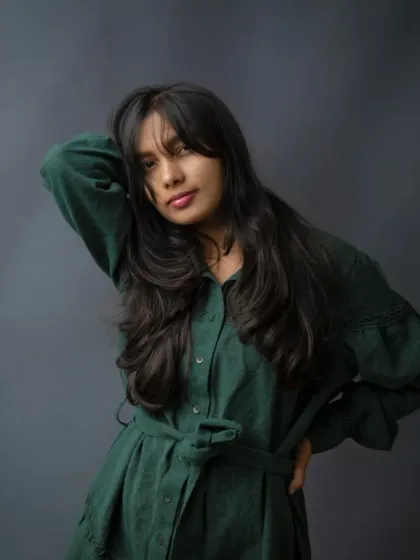 This portrait captures a different side of her personality from the same session. The pose is dynamic and confident, showcasing how we can explore different moods and expressions in one shoot.