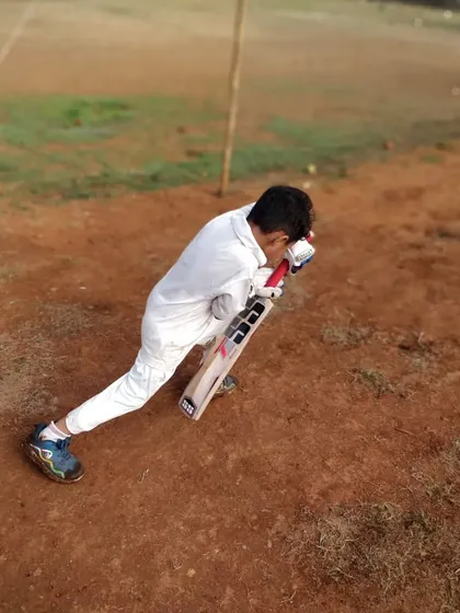 Perfecting the basics is everything. This image shows a young batsman getting his body position right on top of the ball to play a solid defensive shot. This is the kind of technical detail we drill down into during our one on one coaching sessions.