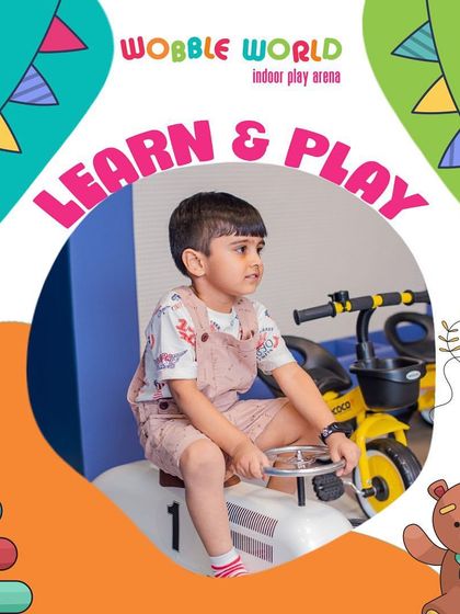 Learn and play go hand in hand here. This little one is having a great time on a ride-on car, developing balance and spatial awareness.