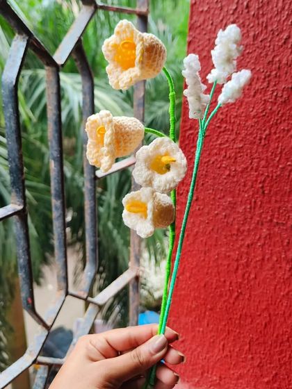 Here are some of my more delicate creations. This bunch includes handmade lily of the valley flowers, with their tiny bell shapes, and a sprig of baby's breath.