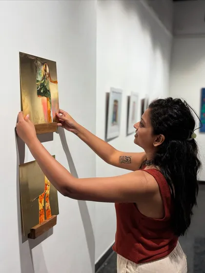 Me installing my 'Mapping Memories' brass artworks at an exhibition. This shows the final step in bringing a conceptual series to the public.