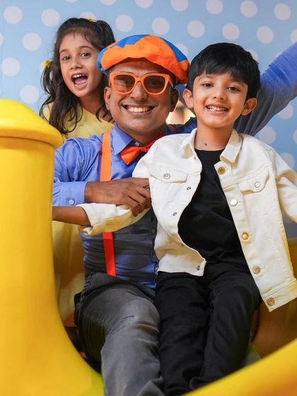 Blippi joining the kids on the slide. Our entertainers are always ready to jump into the fun and play alongside the children.