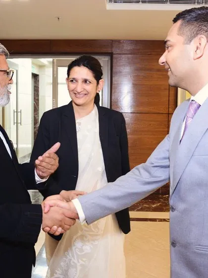 A conversation with fellow advocates at a legal aid function. Building strong relationships and partnerships within the legal community is crucial for expanding the reach and impact of our pro-bono and social welfare initiatives.