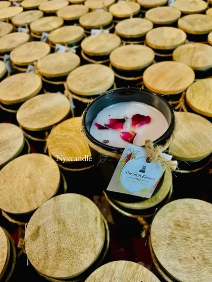 This image showcases the detail of our white-labeling service, with a custom-branded tag attached to a black jar candle. We work with you to ensure the final product aligns perfectly with your brand identity.