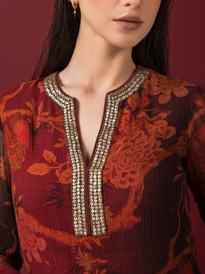 A close-up of the embellished neckline on a printed kurta from Q by Sonia, showcasing the intricate sequin work.