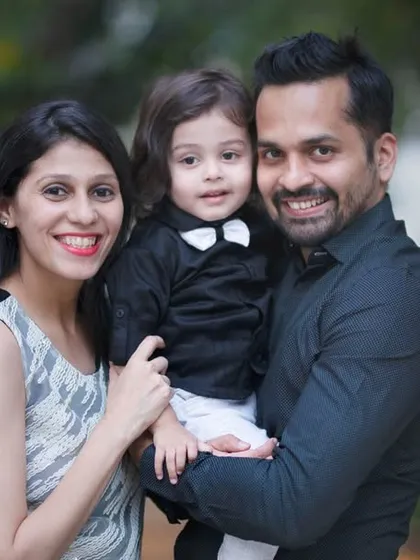 This family looks so dapper for their outdoor portrait. We can plan outfits to create a specific look, like this classic black and white theme for their little boy.