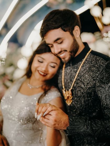 A tender and romantic moment between the couple during their engagement celebration.